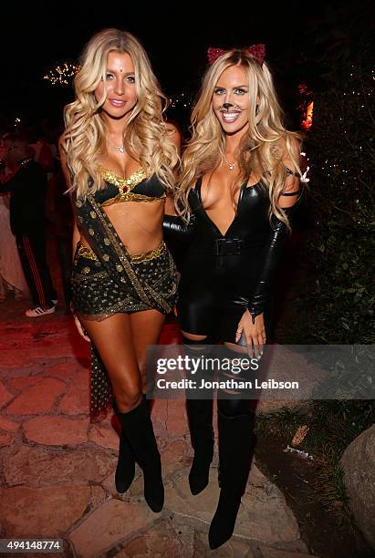 Playmates Monica Sims and Kayla Rae Reid attend the annual Halloween Party, hosted by Playboy and Hugh Hefner, at the Playboy Mansion on October 24,...