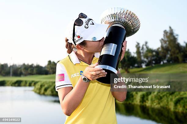 Lydia Ko poses with the trophy on the 18th green after winning 2015 Fubon LPGA Taiwan Championship on October 25, 2015 in Miramar Resort & Country...