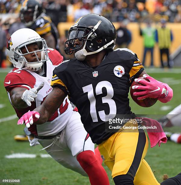Kick returner Dri Archer of the Pittsburgh Steelers runs with the football against safety Tony Jefferson of the Arizona Cardinals during a game at...