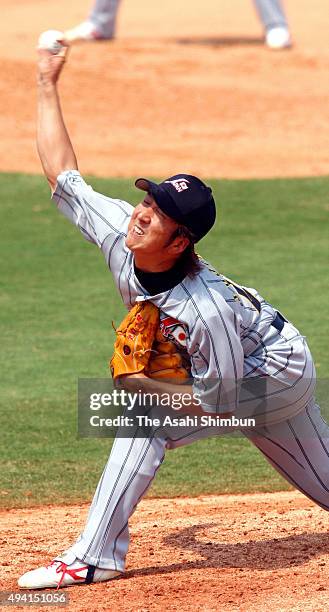 Kyuji Fujikawa of Japan throws during the preliminary round baseball match between Japan and Canada at the Wukesong Baseball Field on Day 10 of the...