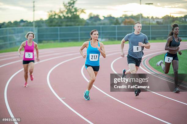 adults racing sprints at the track - fat guy running bildbanksfoton och bilder