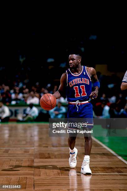 Terrell Brandon of the Cleveland Cavaliers dribbles the ball against the Boston Celtics during a game played at the Boston Garden in Boston,...