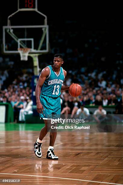 Kendall Gill of the Charlotte Hornets handles the ball against the Boston Celtics during a game played at the Boston Garden in Boston, Massachusetts...