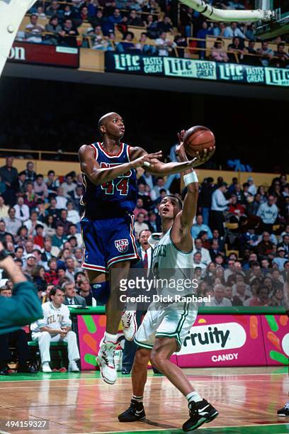 Derrick Coleman of the New Jersey Nets shoots a layup against Alaa Abdelnaby of the Boston Celtics during a game played at the Boston Garden in...