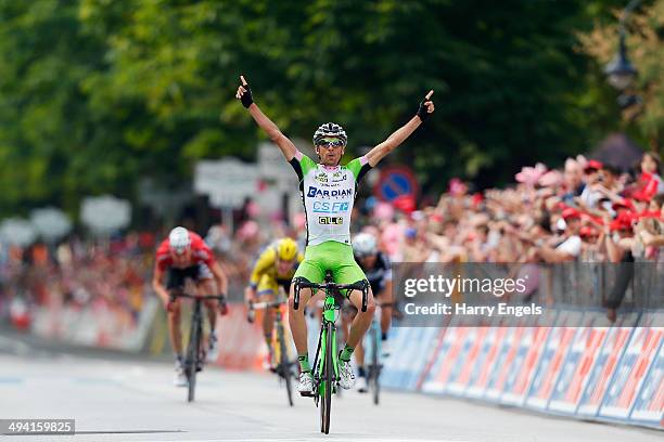 Stefano Pirazzi of Italy and team Bardiani CSF celebrates crossing the line to win the seventeenth stage of the 2014 Giro d'Italia, a 208km stage...