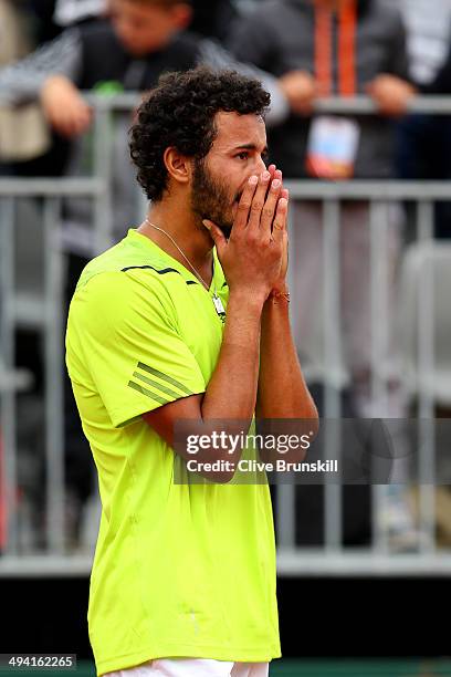 Laurent Lokoli of France reacts after his defeat in his men's singles match against Steve Johnson of the United States on day four of the French Open...