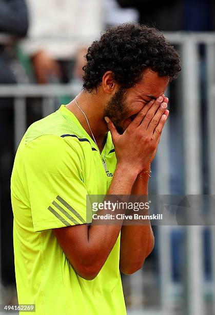 Laurent Lokoli of France reacts after his defeat in his men's singles match against Steve Johnson of the United States on day four of the French Open...