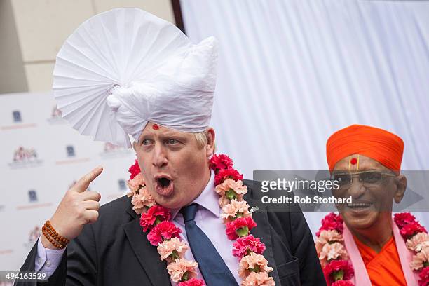 The Mayor of London Boris Johnson wears a traditional headdress during a visit to the Shree Swaminarayan Mandir, a major new Hindu temple being built...