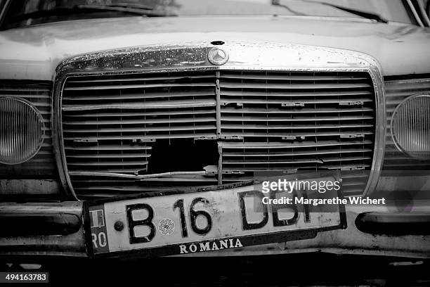 June 02: A license plate hangs on the radiator grill of an old Mercedes Benz on June 2, 2011 in Bucharest, Romania.