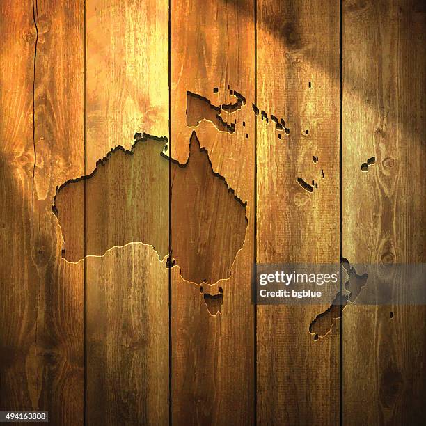 oceania map on lit wooden background - french polynesia stock illustrations