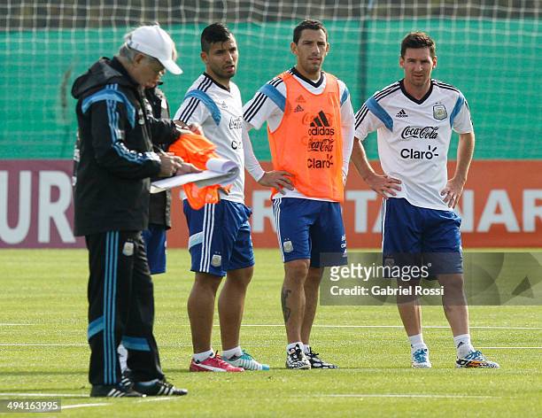 Sergio Aguero, Maximiliano Rodriguez and Lionel Messi of Argentina during a training session at Ezeiza Training Camp on May 28, 2014 in Ezeiza,...
