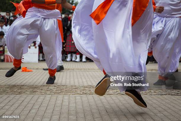 Men perform a traditional Indian dance for Mayor of London Boris Johnson at Shree Swaminarayan Mandir, a major new Hindu temple being built in...