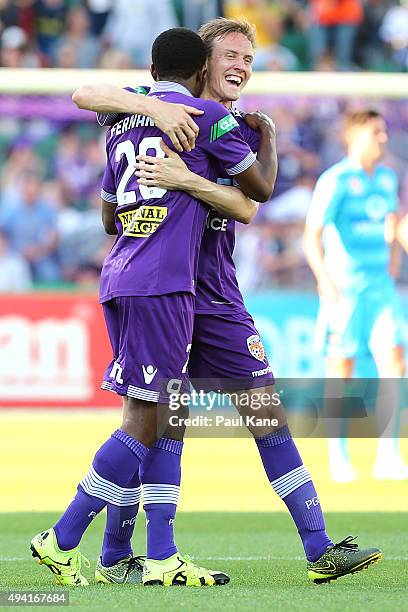 Guyon Fernandez and Michael Thwaite of the Glory celebrate a goal during the round three A-League match between Perth Glory and Adelaide United at...