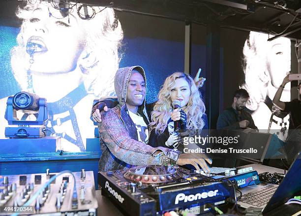 Lunice performs as singer Madonna speaks at Marquee Nightclub at The Cosmopolitan of Las Vegas as Madonna hosts an after party for her Rebel Heart...