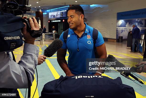 Manusamoa Tuilagi from the English rugby team arrives at the Auckland International Airport in Auckland on May 29, 2014. The England Rugby team are...