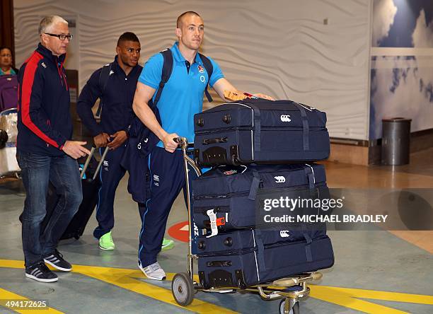 Mike Brown and Courtney Lawes from the English rugby team arrives at the Auckland International Airport in Auckland on May 29, 2014. The England...
