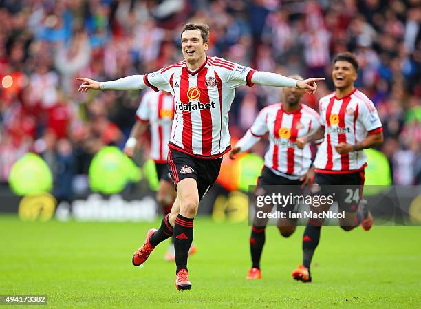 Adam Johnson of Sunderland celebrates scoring his team's first goal from the penalty spot during the Barclays Premier League match between Sunderland...