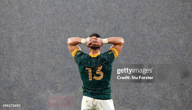 Jesse Kriel of South Africa holds his head in his hands in dejection as the rain falls during the 2015 Rugby World Cup Semi Final match between South...