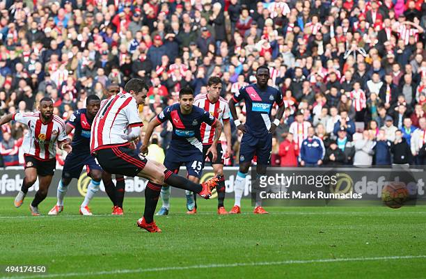 Adam Johnson of Sunderland scores his team's first goal from the penalty spot during the Barclays Premier League match between Sunderland and...