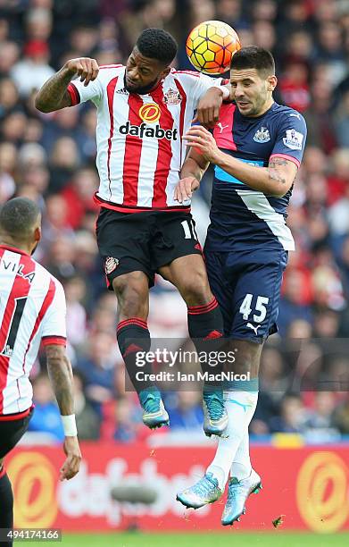 Jeremain Lens of Sunderland and Aleksandar Mitrovic of Newcastle United compete for the ball during the Barclays Premier League match between...