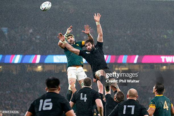 Sam Whitelock of New Zealand steals lineout ball from Victor Matfield of South Aftrica during the 2015 Rugby World Cup Semi Final match between South...
