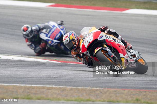 Dani Pedrosa of Spain and Repsol Honda Team leads Jorge Lorenzo of Spain and Movistar Yamaha MotoGP during the MotoGP race during the MotoGP Of...
