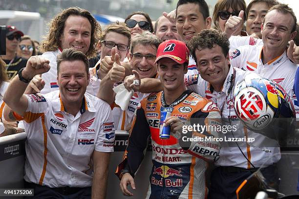 Dani Pedrosa of Spain and Repsol Honda Team celebrates the victory with team at the end of the MotoGP race during the MotoGP Of Malaysia at Sepang...