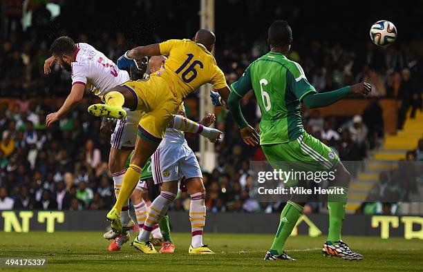 Grant Hanley of Scotland has goal disallowed for a foul on goalkeeper Austine Ejide of Nigeria during an International Friendly between Scotland and...
