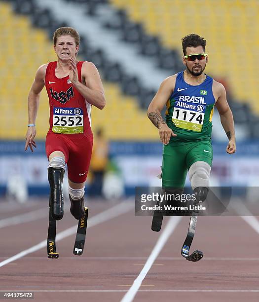 Hunter Woodhall of the United States and Alan Oliveira of Brazil compete in the men's 200m T44 final during the Evening Session on Day Four of the...