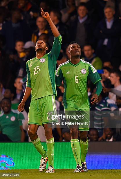 Micahel Uchebo of Nigeria celebrates with Azubuike Egwuekwe after scoring during an International Friendly between Scotland and Nigeria at Craven...