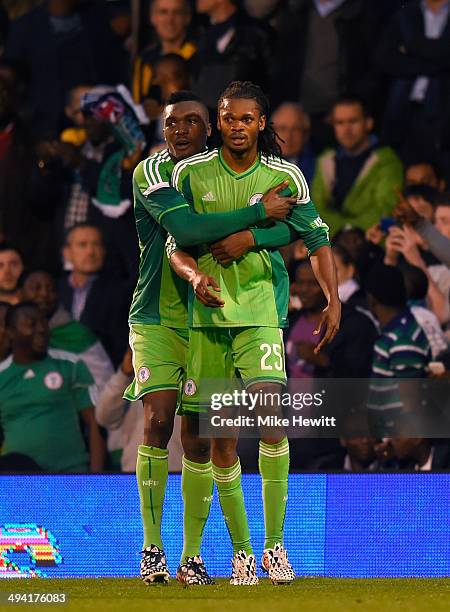 Micahel Uchebo of Nigeria celebrates with Azubuike Egwuekwe after scoring during an International Friendly between Scotland and Nigeria at Craven...