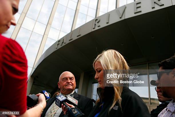 Defense attorney John Connors, second from left, who is representing Carlos Ortiz, talks to reporters outside of the courthouse following Ortiz's...