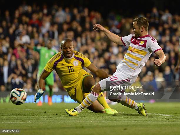 Shaun Maloney of Scotland beats the dive of Austine Ejide of Nigeria during the International Friendly match between Nigeria and Scotland at Craven...
