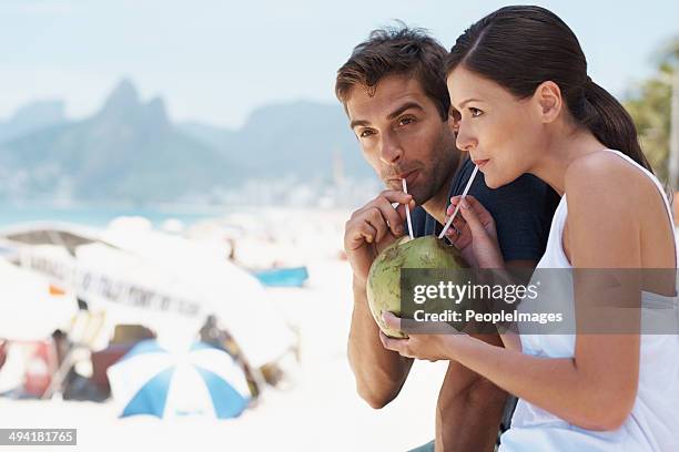 enjoying something new with the person i love - coconut water stock pictures, royalty-free photos & images