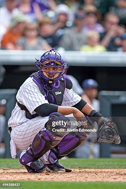 Catcher Wilin Rosario of the Colorado Rockies in action against the San Diego Padres at Coors Field on May 18, 2014 in Denver, Colorado. The Rockies...