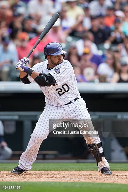 Wilin Rosario of the Colorado Rockies bats against the San Diego Padres at Coors Field on May 18, 2014 in Denver, Colorado. The Rockies defeated the...