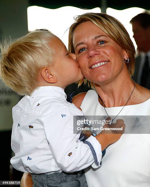 Annika Sorenstam poses with her son William following the memorial induction ceremony prior to the Memorial Tournament presented by Nationwide...