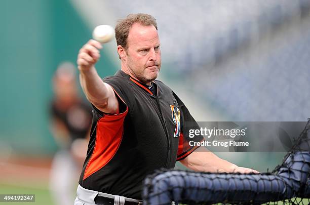 Manager Mike Redmond of the Miami Marlins throws during batting practice before the game against the Washington Nationals at Nationals Park on May...