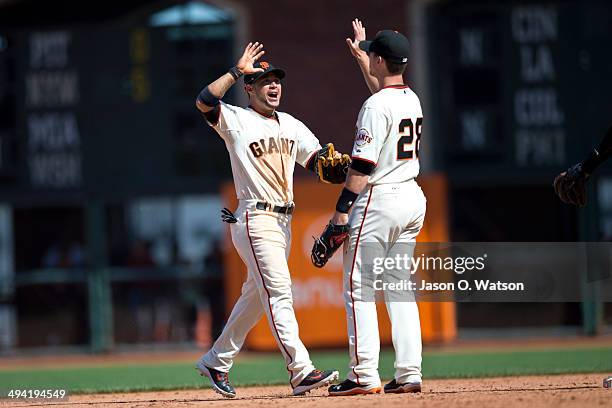 Gregor Blanco of the San Francisco Giants celebrates with Buster Posey after the game against the Chicago Cubs at AT&T Park on May 28, 2014 in San...
