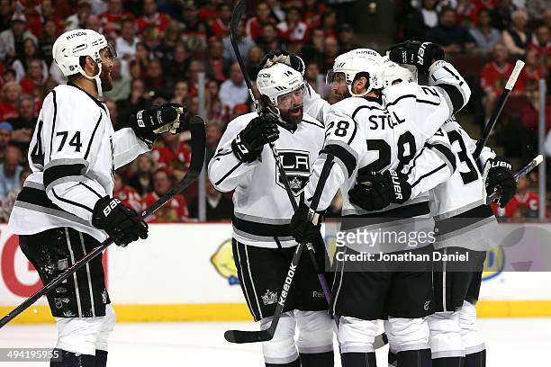 Jarret Stoll of the Los Angeles Kings celebrates with his teammates after scoring a goal against Corey Crawford of the Chicago Blackhawks in the...