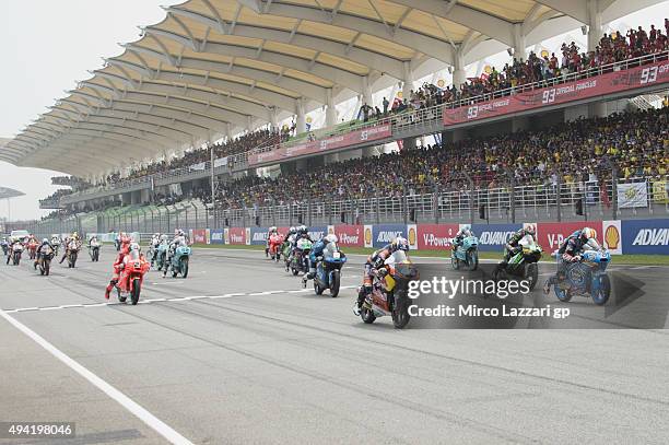 The Moto3 riders start from the grid during the Moto3 race during the MotoGP Of Malaysia at Sepang Circuit on October 25, 2015 in Kuala Lumpur,...