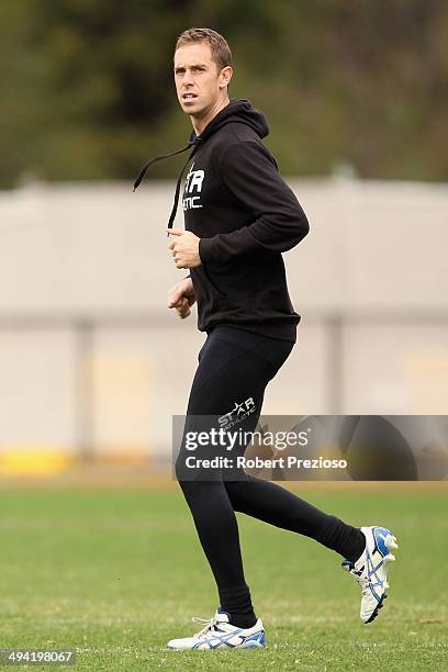 Nick Maxwell runs during a Collingwood Magpies AFL training session at Olympic Park on May 29, 2014 in Melbourne, Australia.