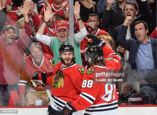 Brandon Saad and Patrick Kane of the Chicago Blackhawks celebrate after Saad scored against the Los Angeles Kings in the first period in Game Five of...