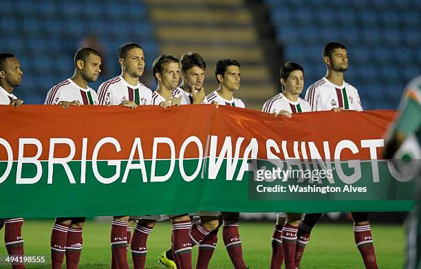 Players of Fluminense enter the field before a match between Atletico MG and Fluminense as part of Brasileirao Series A 2014 at Joao Lamego Stadium...