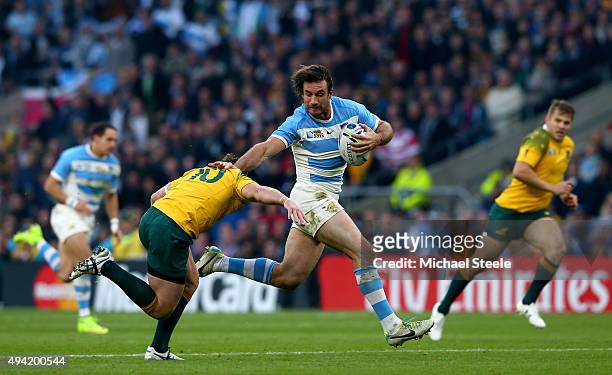 Marcelo Bosch of Argentina make a break as he is closed down by Bernard Foley of Australia during the 2015 Rugby World Cup Semi Final match between...