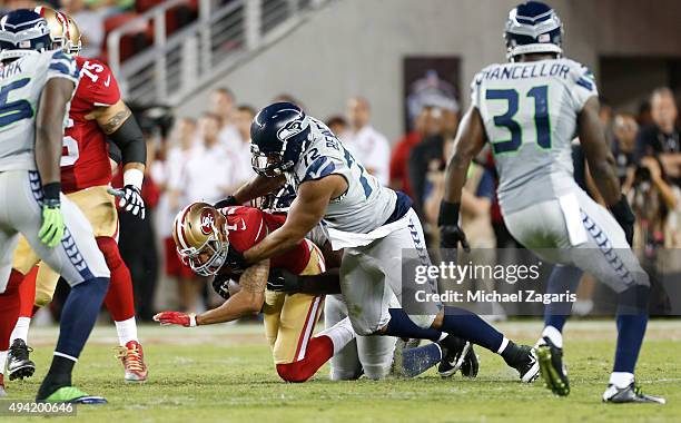 Michael Bennett of the Seattle Seahawks sacks Colin Kaepernick of the San Francisco 49ers during the game at Levi Stadium on October 22, 2015 in...