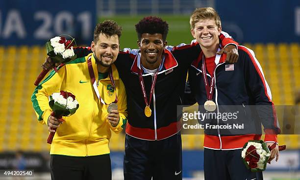 Richard Browne of the United States poses with his gold, Alan Oliveira of Brazil silver and Hunter Woodhall of the United States bronze afterthe...