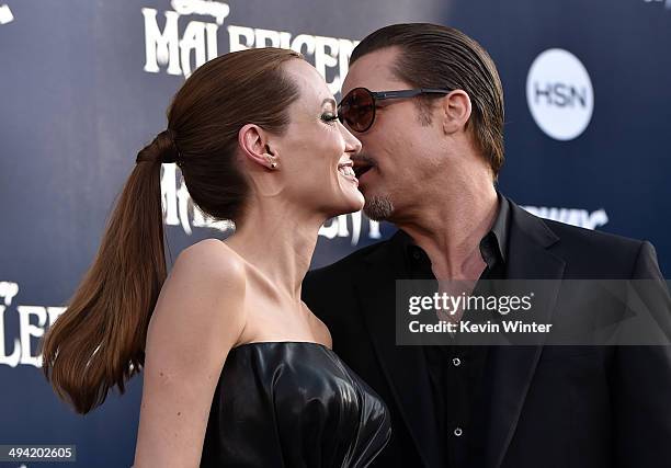 Actors Angelina Jolie and Brad Pitt attend the World Premiere of Disney's "Maleficent" at the El Capitan Theatre on May 28, 2014 in Hollywood,...