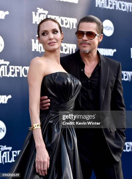 Actors Angelina Jolie and Brad Pitt attend the World Premiere of Disney's "Maleficent" at the El Capitan Theatre on May 28, 2014 in Hollywood,...