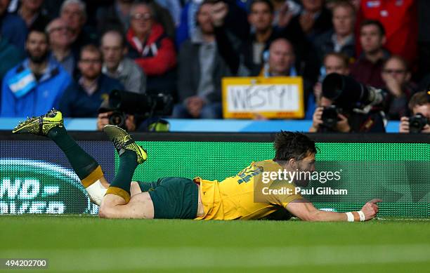 Adam Ashley-Cooper of Australia dives over to score his sides third try during the 2015 Rugby World Cup Semi Final match between Argentina and...